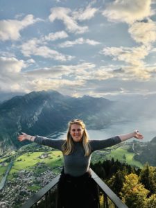 Catherine Foster standing on top of a mountain